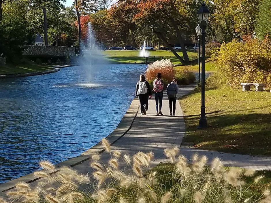 Endicott students walk by campus lakes