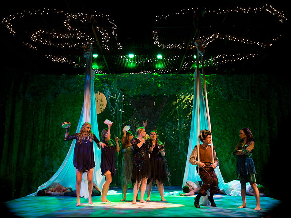 Tia's theatre dance performance students performing under sparkling lights
