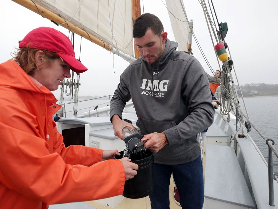 Endicott student and faculty member aboard ship as part of oceanography class