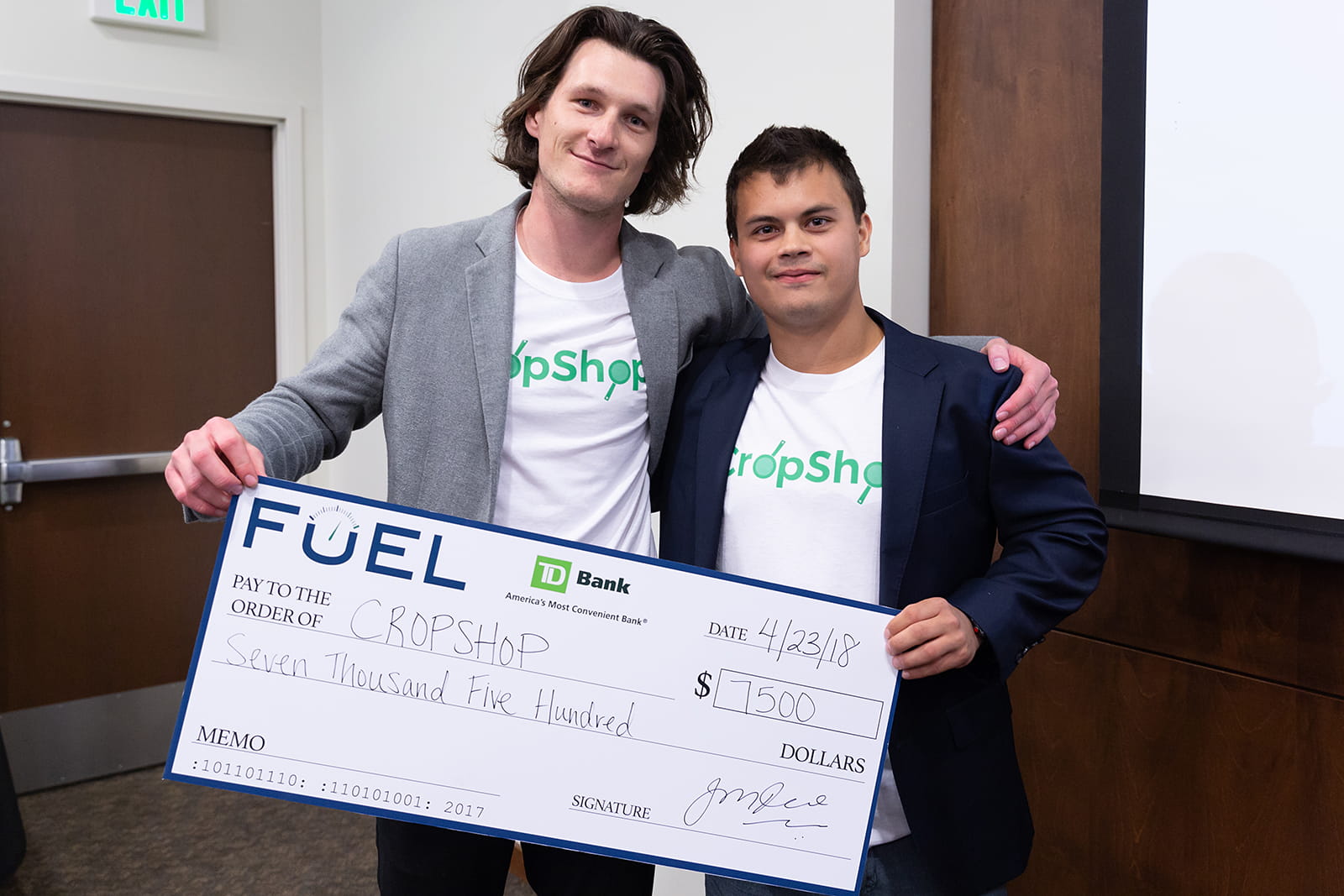 Endicott College Entrepreneurship Spark Tank Winners - two students holding a check