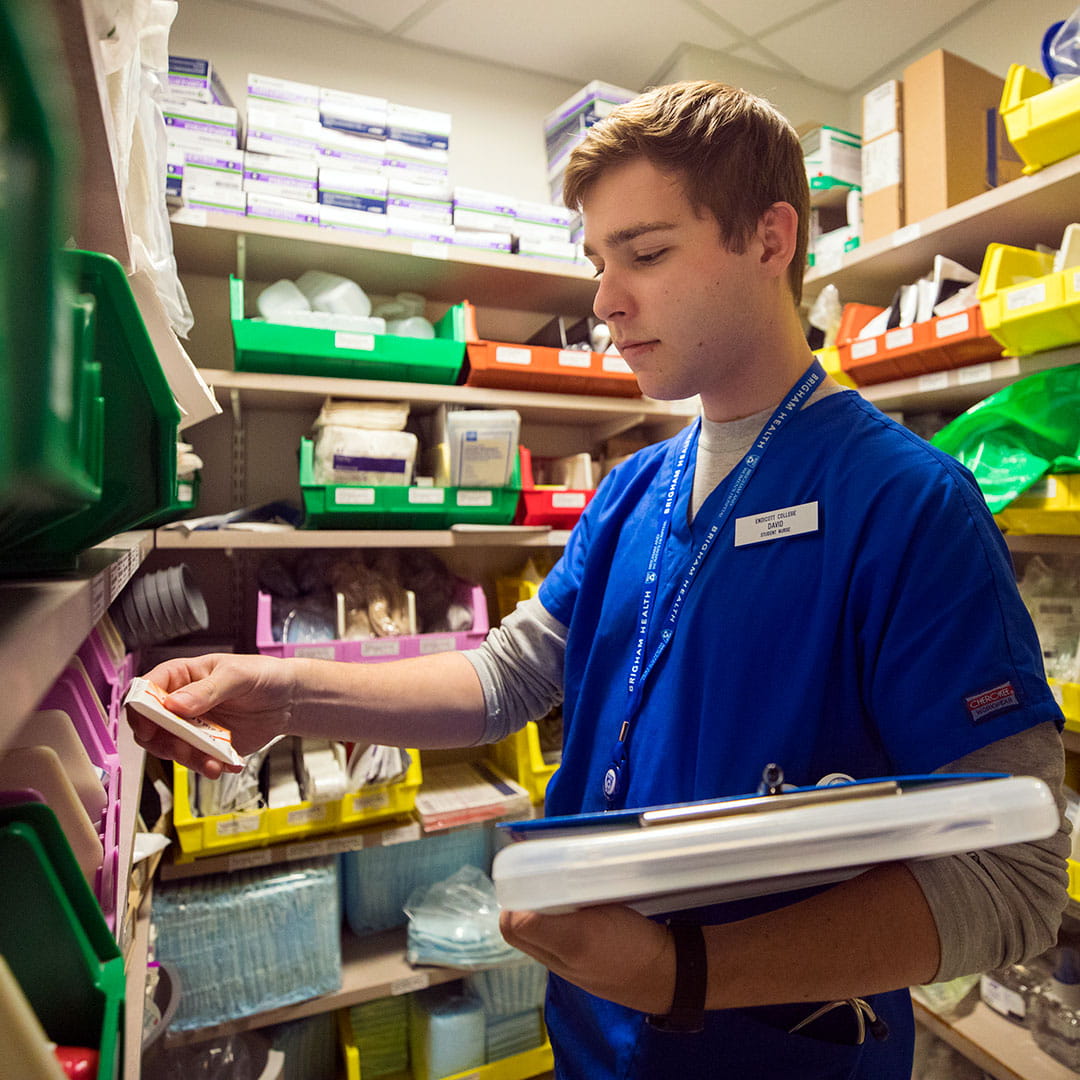 Student working in a storage room at a hospital
