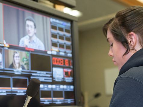 student working behind the scenes in tv/film studio