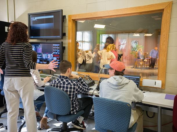 Endicott College students working in a TV production room