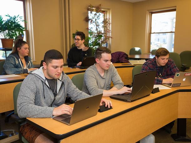Endicott College students in a communications classroom
