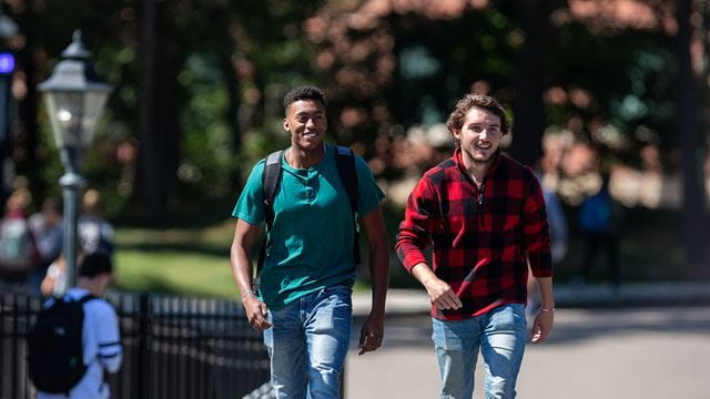 Two male students walk on the Endicott College campus