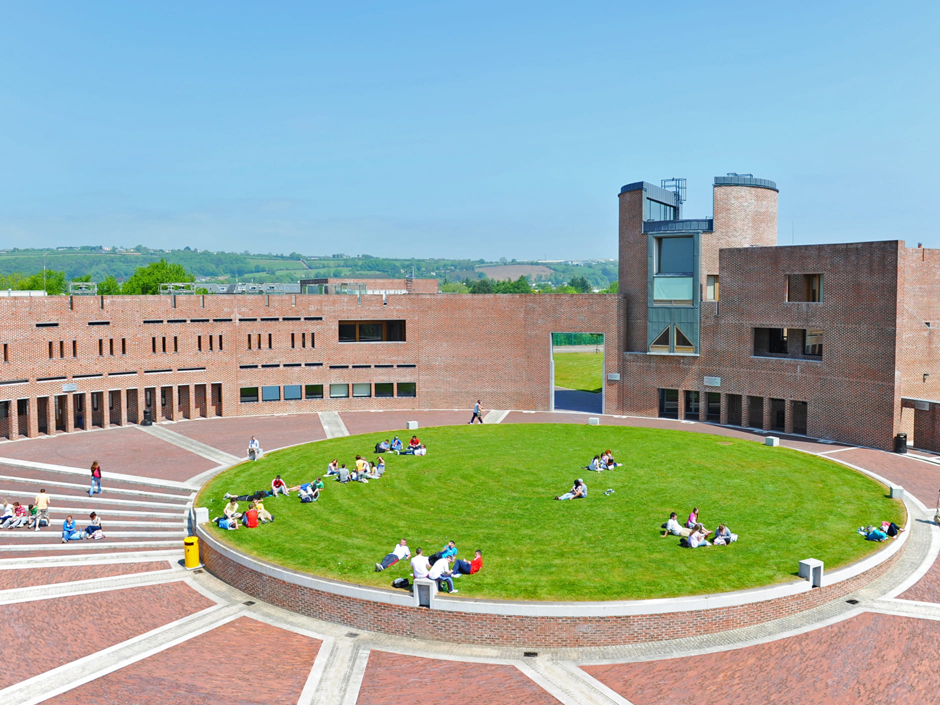 Cork Institute of Technology campus with students sitting on lawn