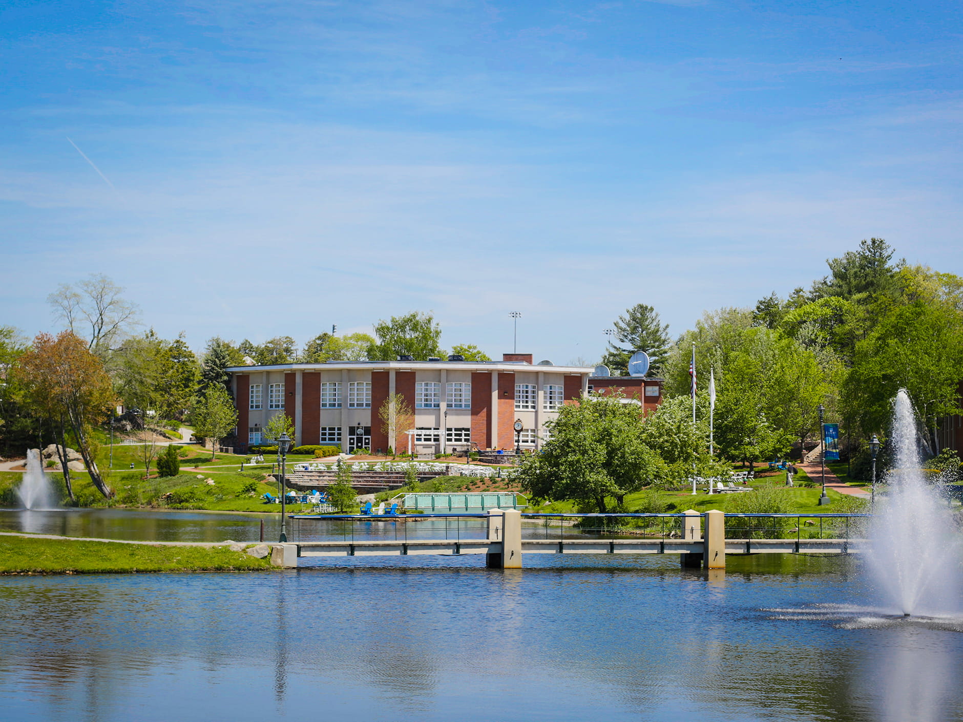 A summer Endicott College campus view of the ponds and the Wax Academic Center. 
