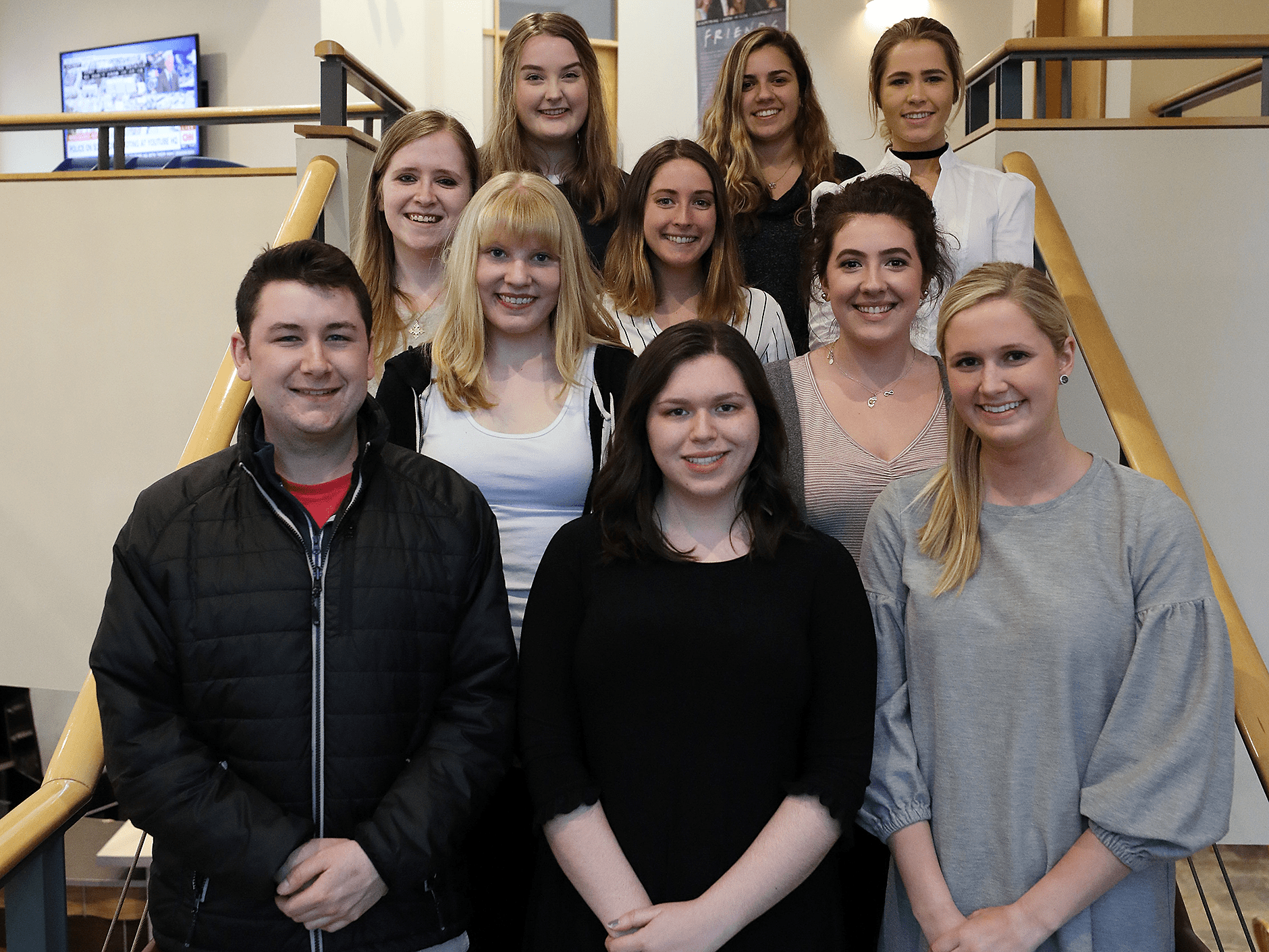 Endicott students on stairway at National Student Advertising Compentition