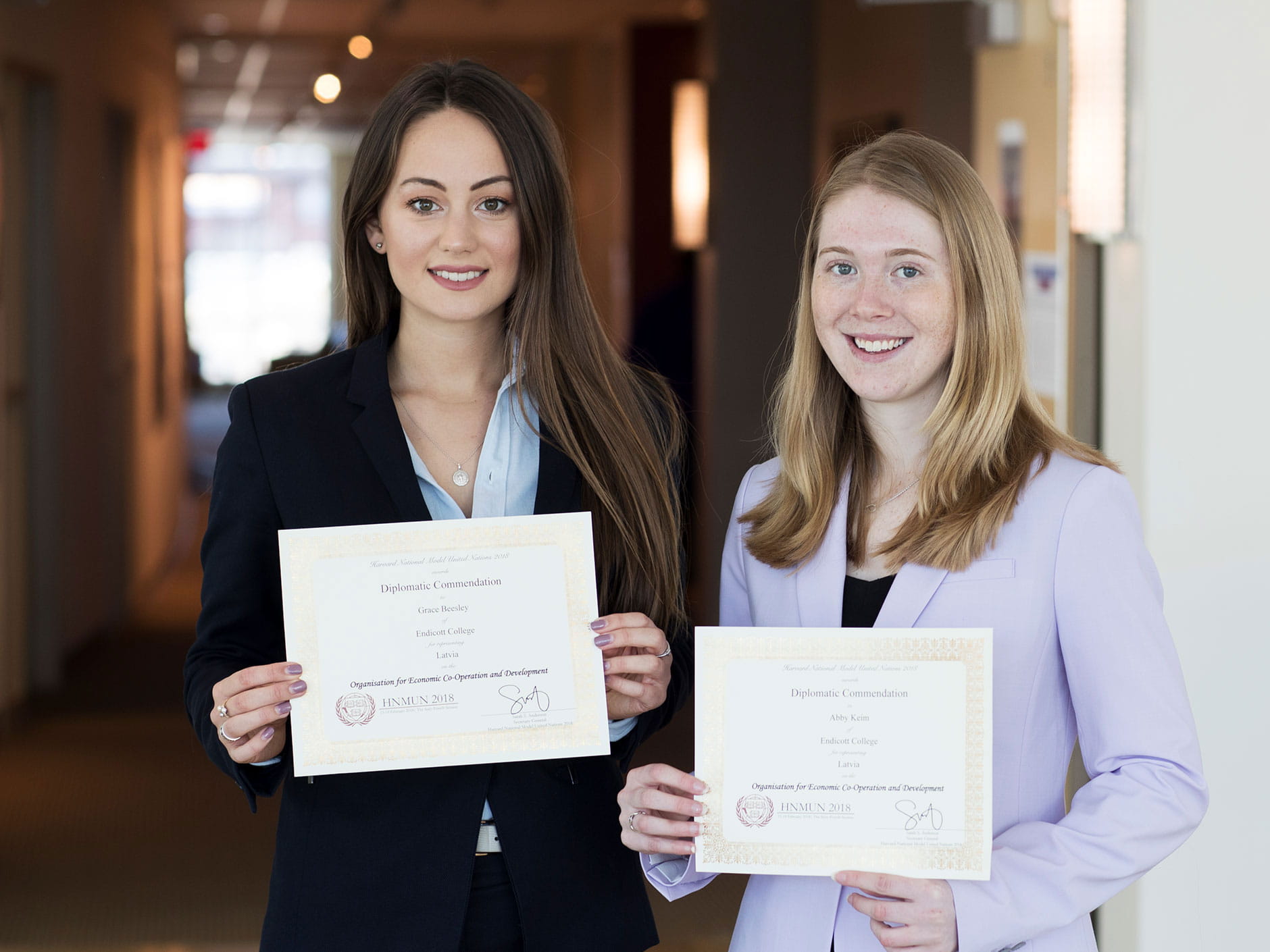 Grace Beesley ‘19 and Abigail Keim ‘19 hold their Diplomatic Commendation Awards. 