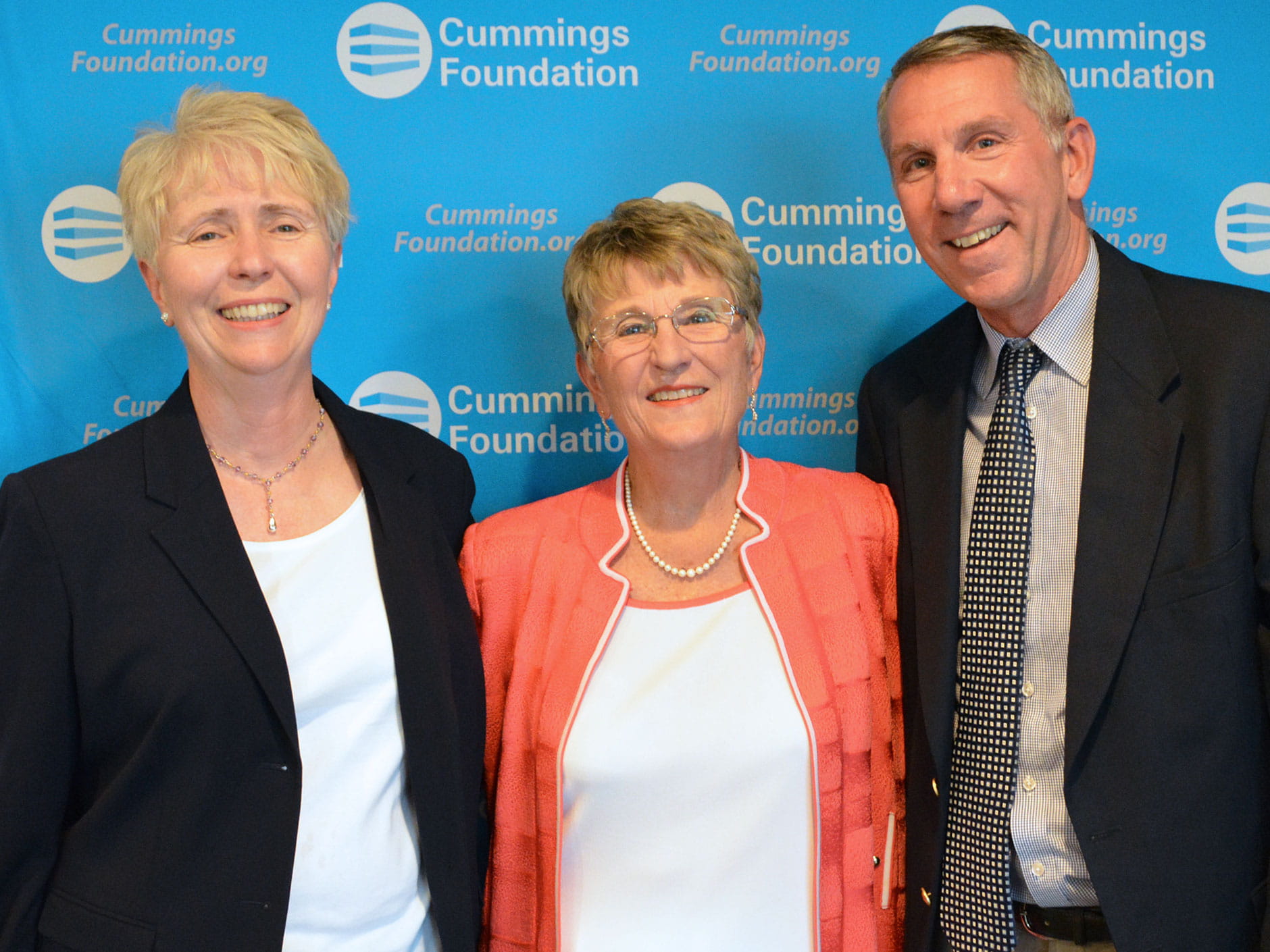 Joyce Cummings stands with Deirdre Sartorelli and David Vigneron of Endicott College