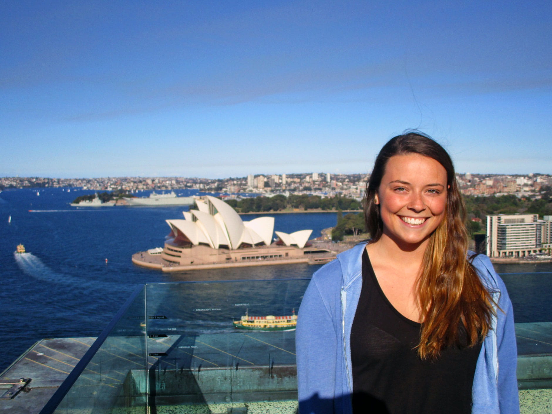 Student posing with the Sydney Opera House in the background