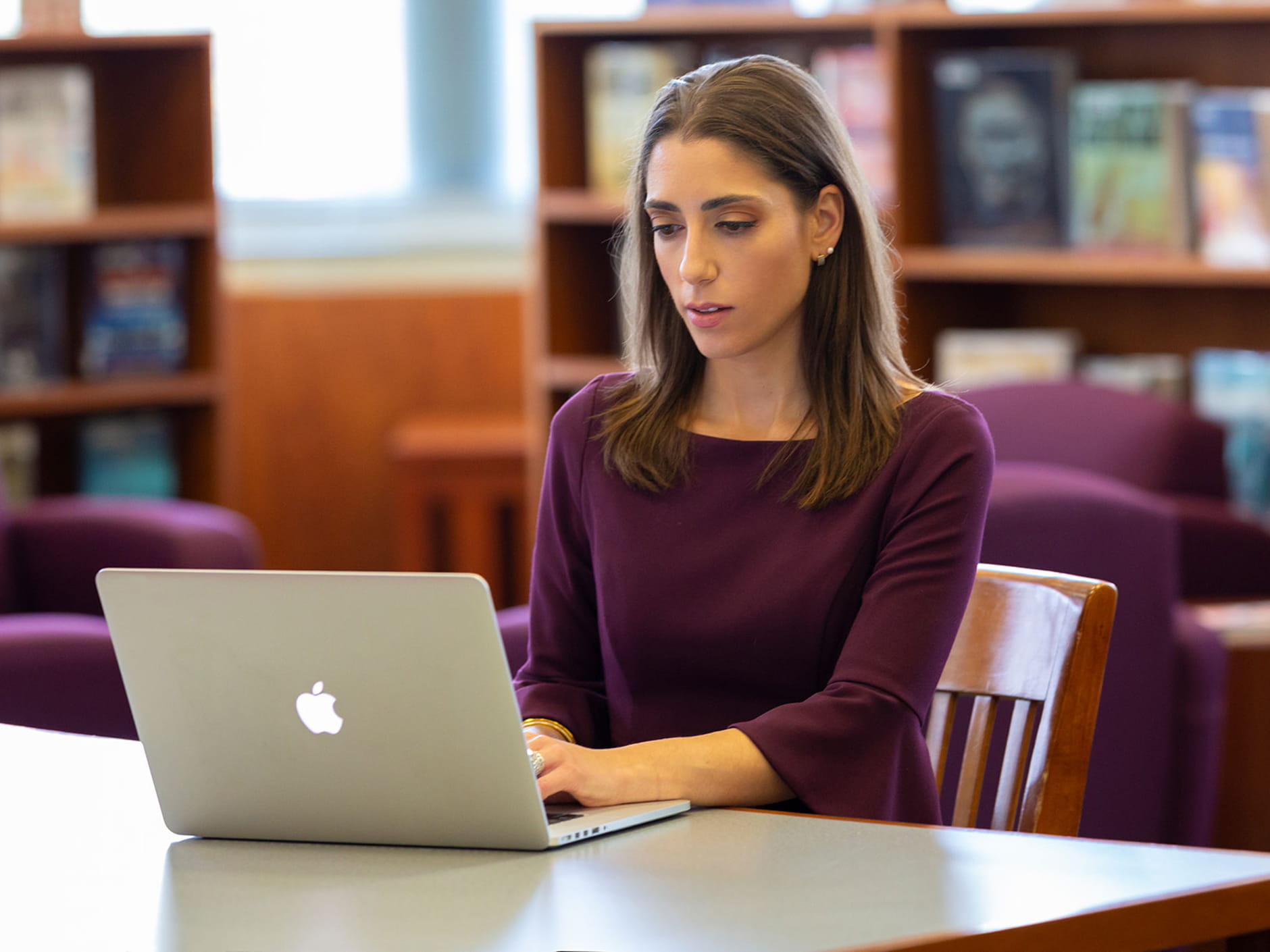 Lara Salahi working at her computer. 
