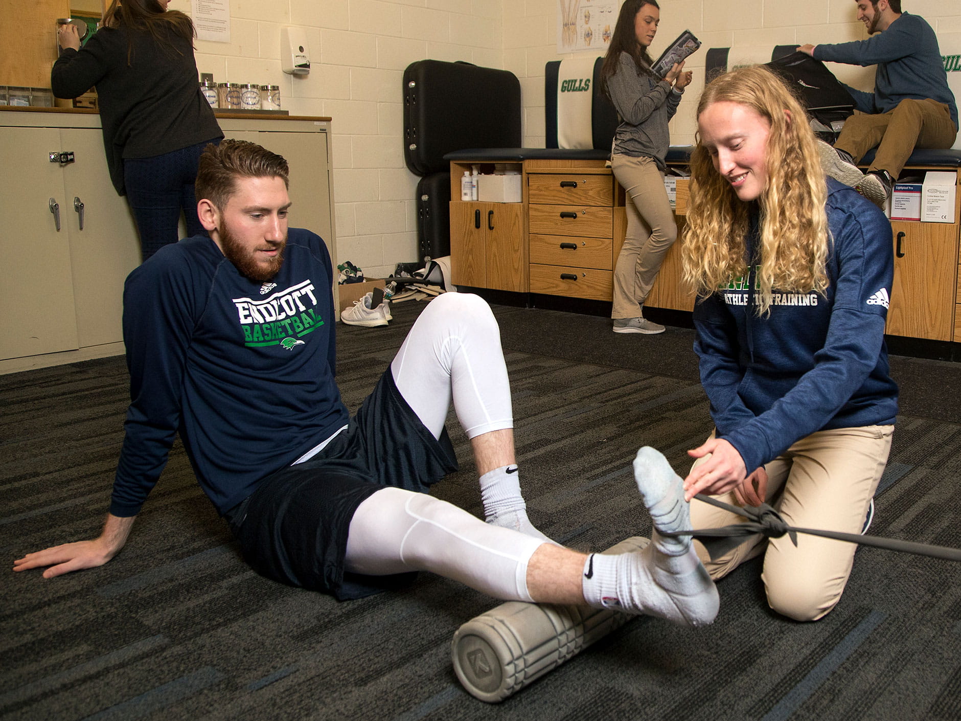 Elizabeth Hutchins '19 working on a male student-athlete