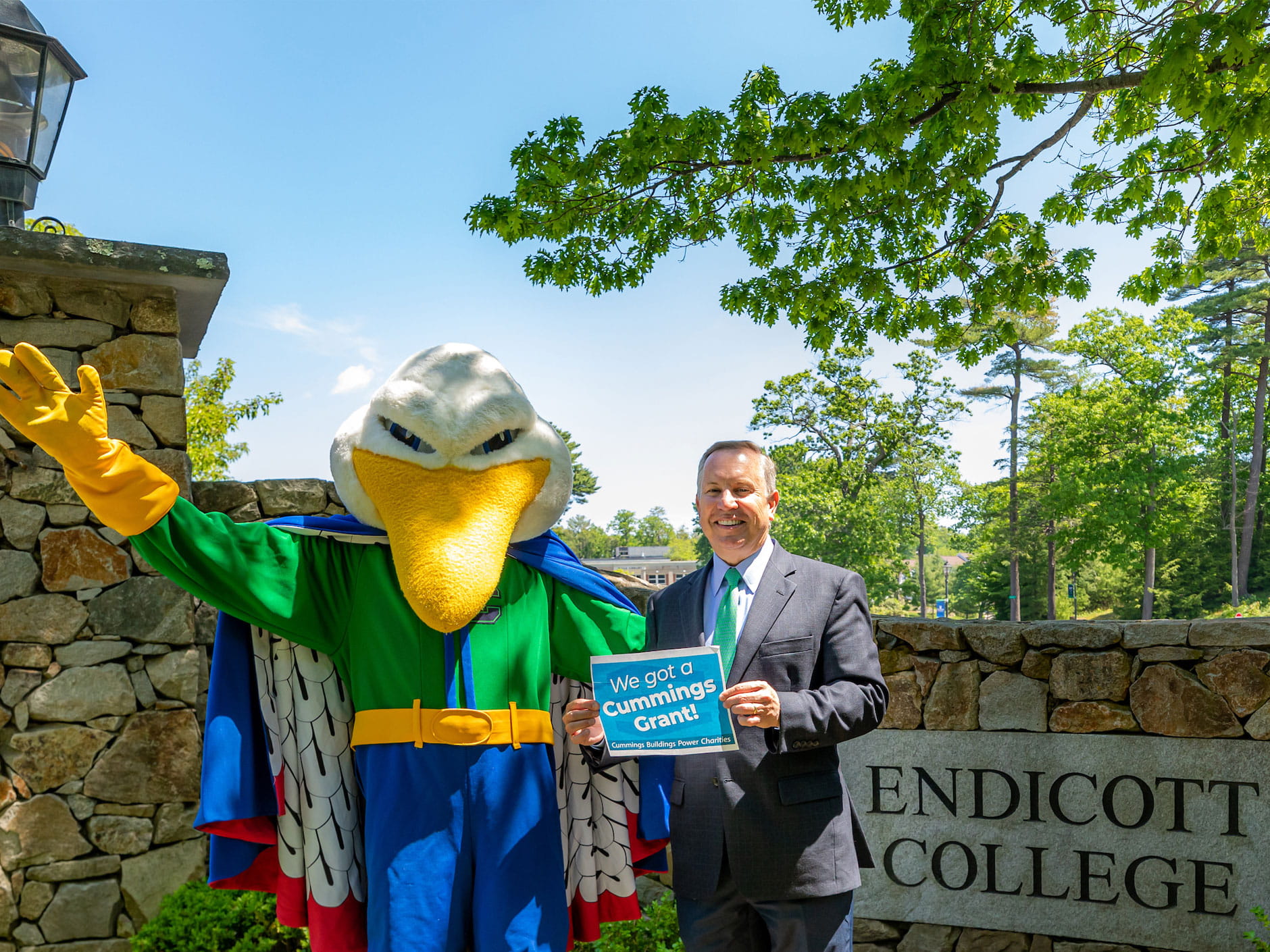President Steven R. DiSalvo, Ph.D., poses with the Gulls mascot