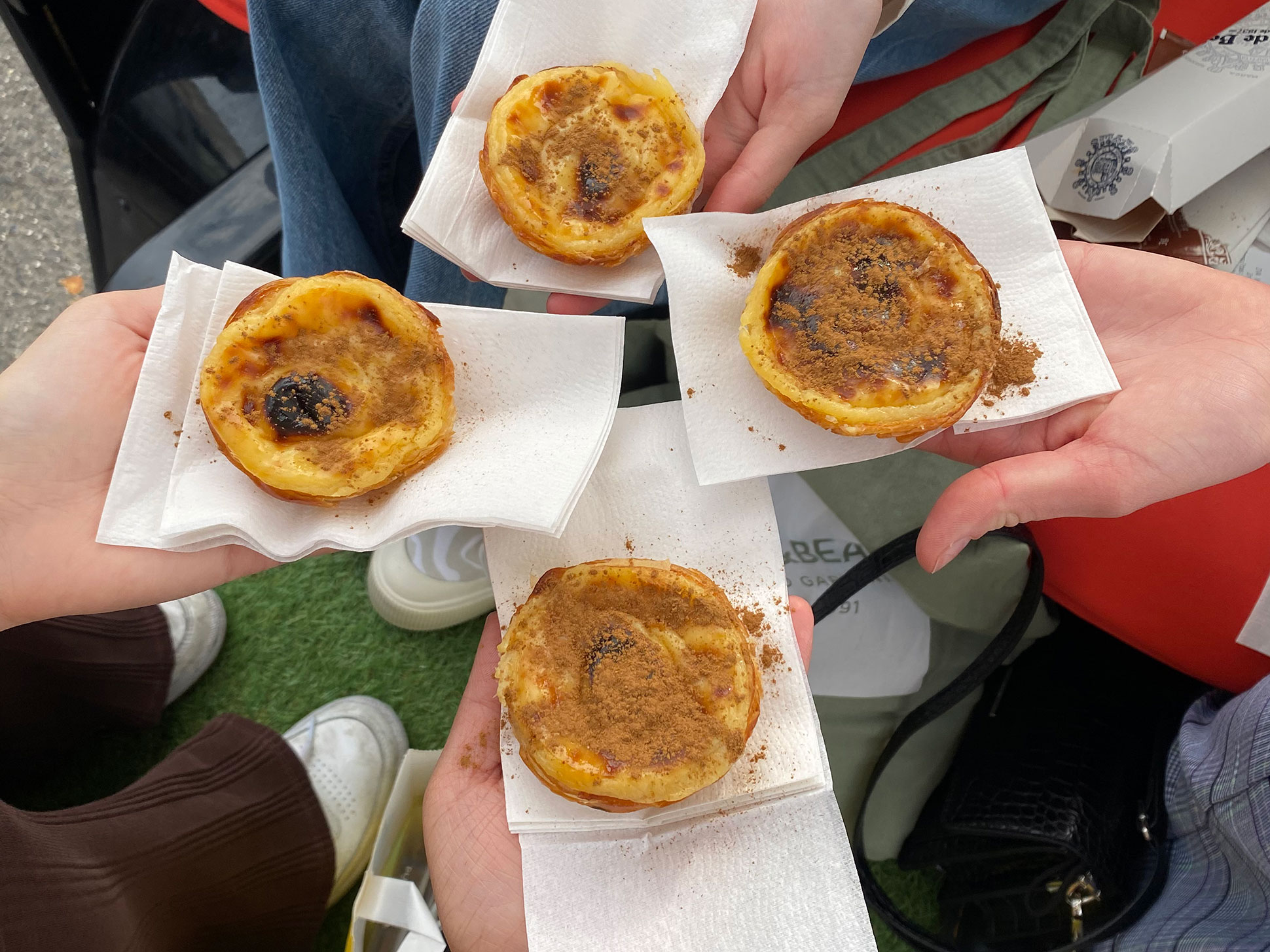 Battiata’s meals in Lisbon, Portugal, including local prawns and pastel de nata, traditional Portuguese custard tarts. 