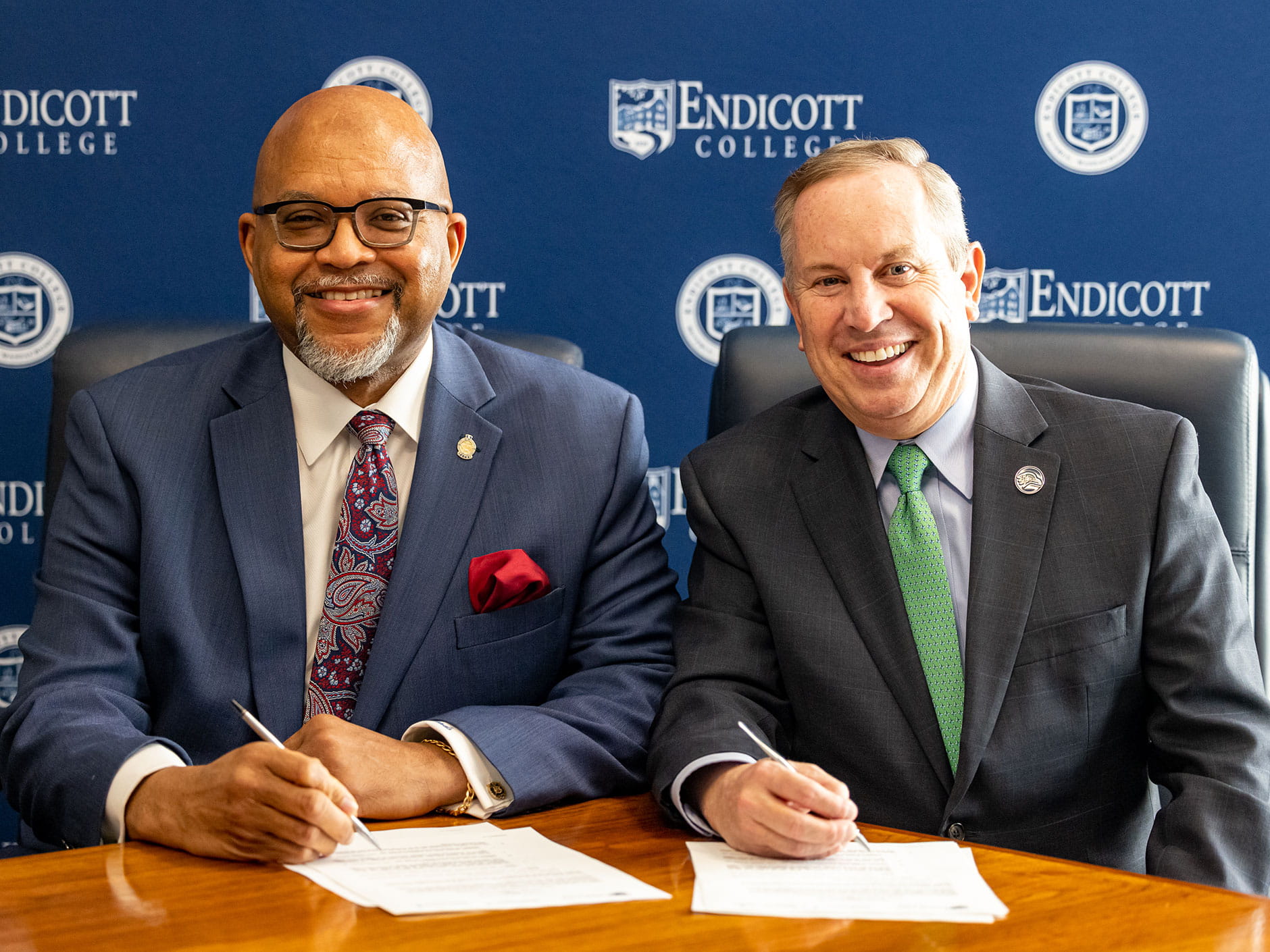 Tom Sands (left), President of Beverly and Addison Gilbert Hospitals, and Steven R. DiSalvo, Ph.D., President of Endicott College sign the agreement. 
