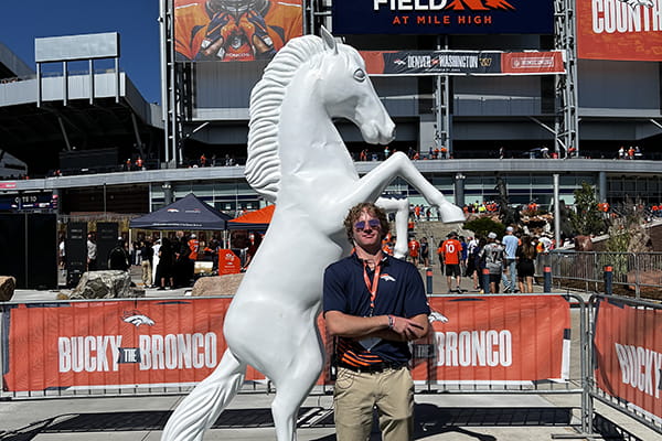 Brandon Basile ’24 is working behind the scenes with the Denver Broncos, supporting event and game day management for the team.