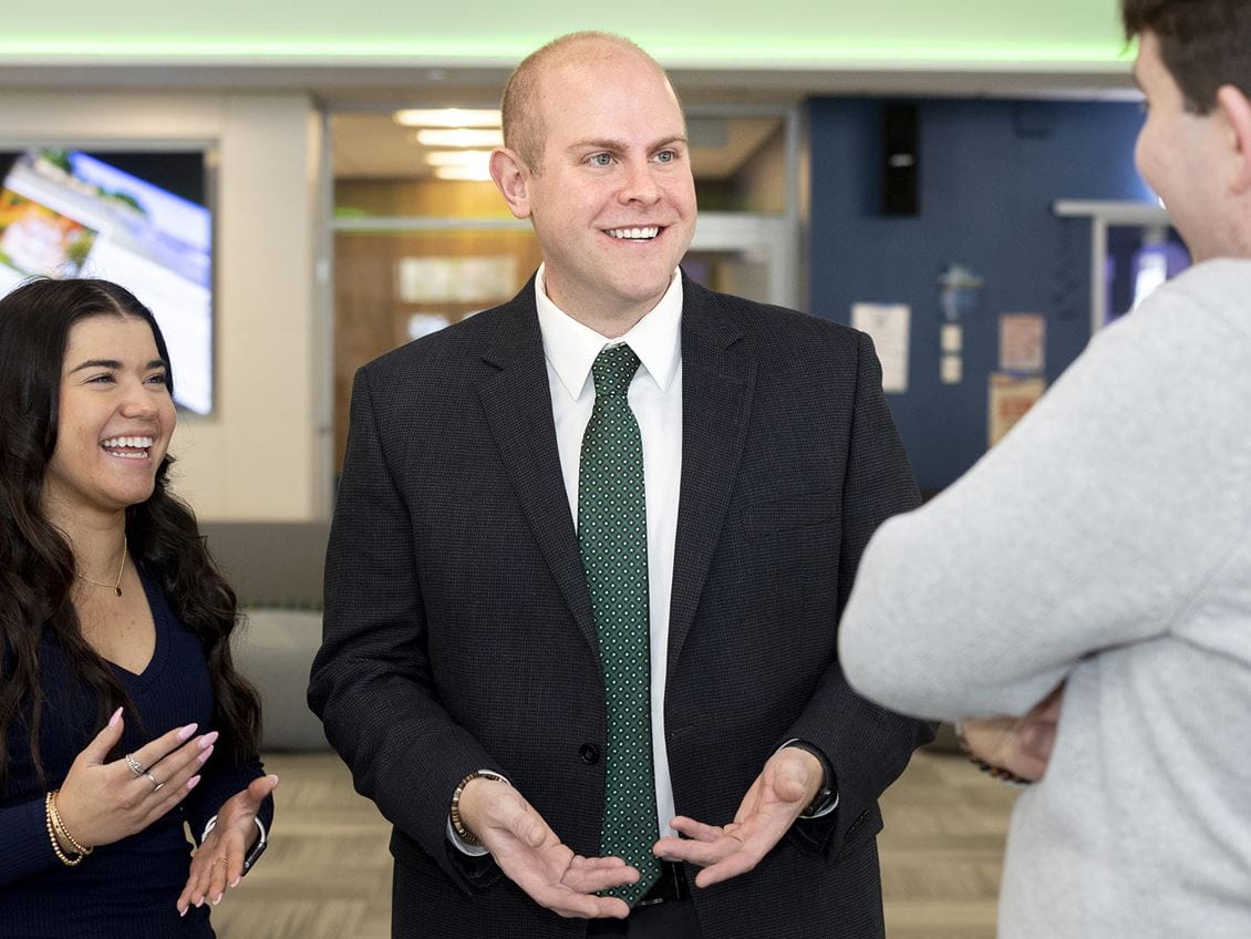 Dean Matt Heiser talking with students