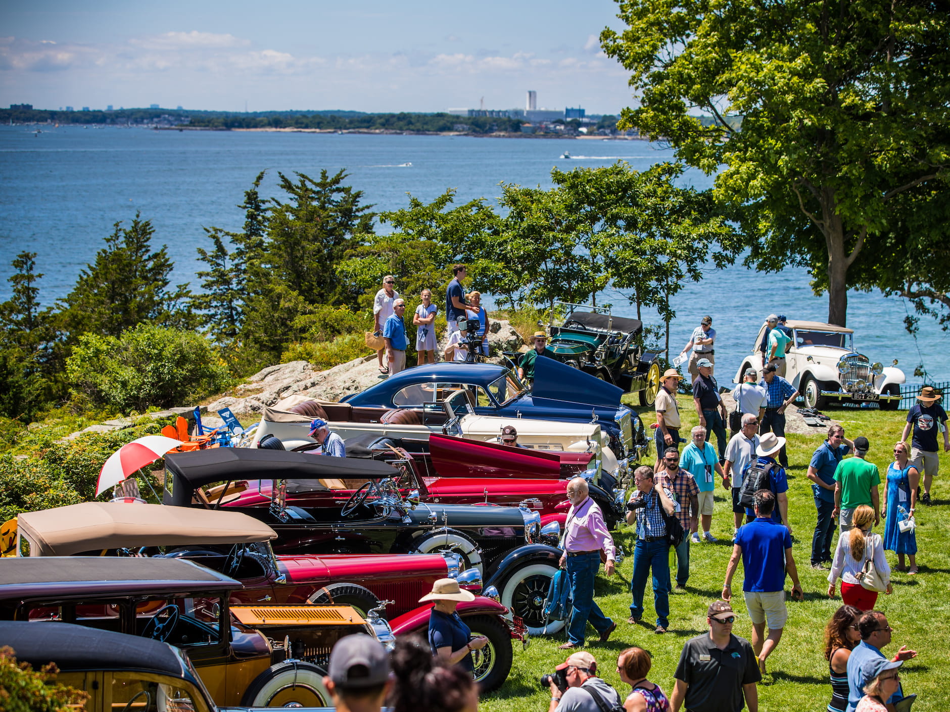 Attendees gather to look at classic cars at the Misselwood Concours d'Elegance at Endicott College. Photo by Deremer Studios LLC.