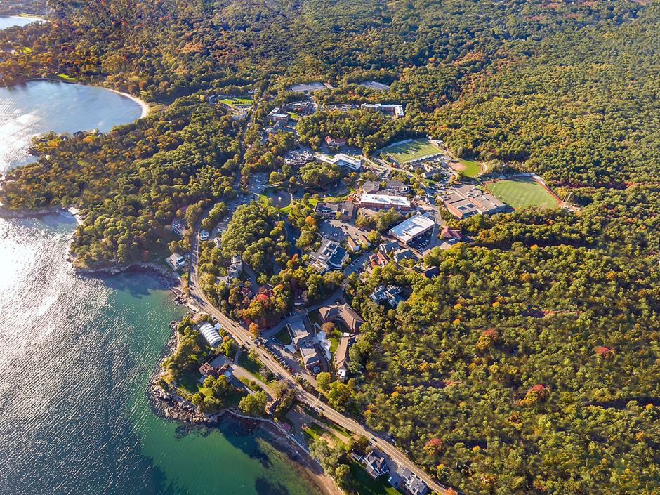 Aerial shot of Endicott College campus and ocean coastline.