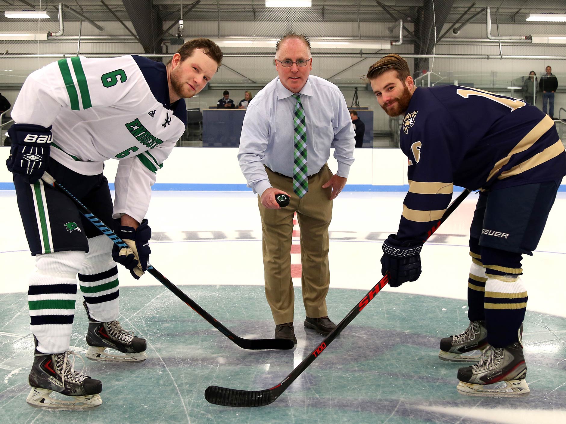 Bourque Arena two hockey players waiting for the puck to be dropped by the  Director of Athletics