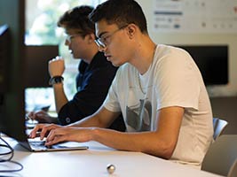 two male students at work