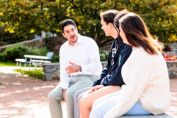 Chris Westgate talking with students