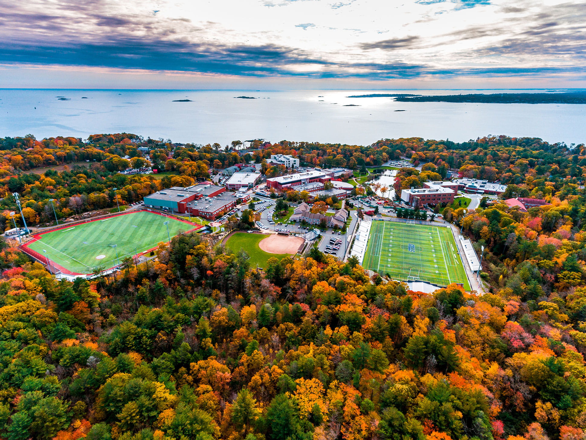 aerial shot of athletic facilities with ocean in the backdrop