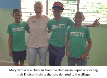 Mary with a few kids from the Dominican Republic sporting their Endicott t-shirts