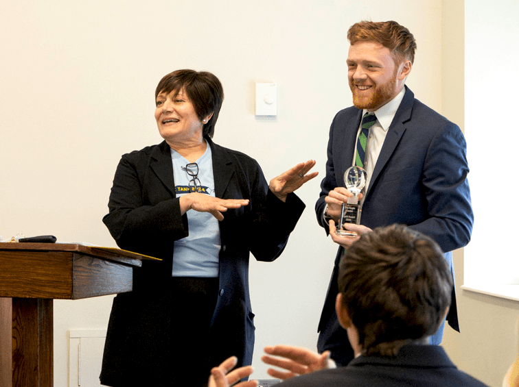 Faculty and student in class