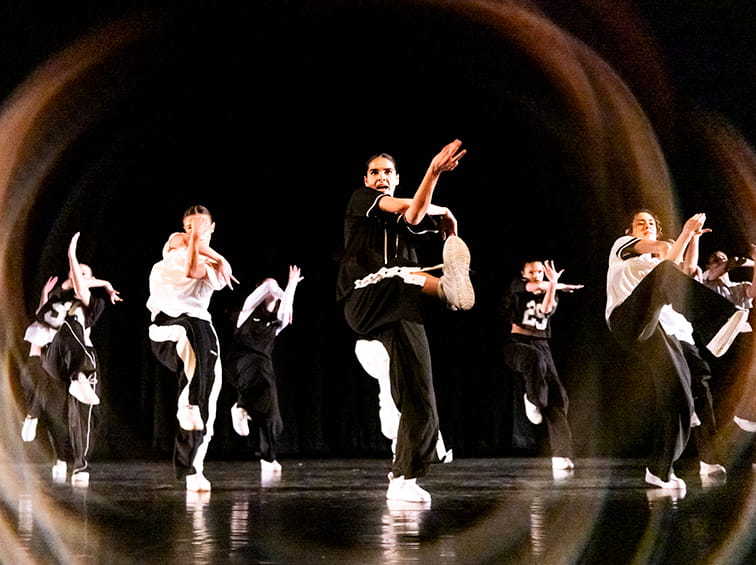 Students performing on stage