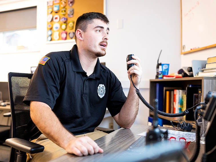An officer on a radio