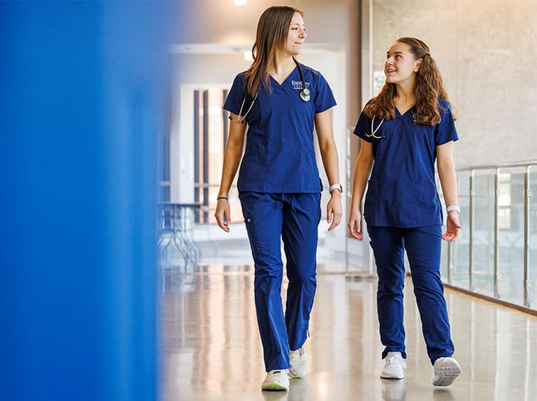 Nursing students walking down the hall