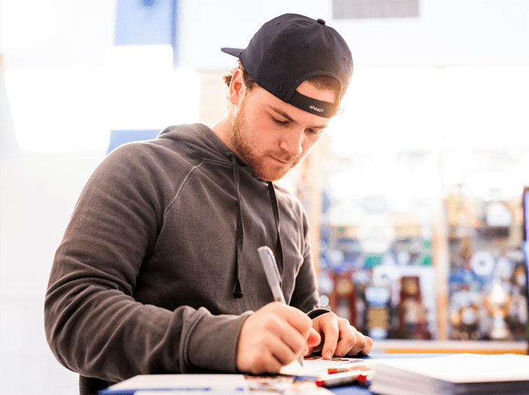 Student writing notes