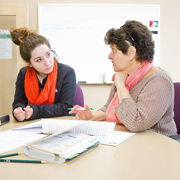 Amy Cohn working with a student
