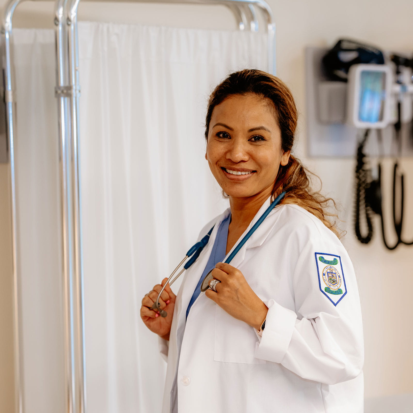 Nurse posing in an evaluation room