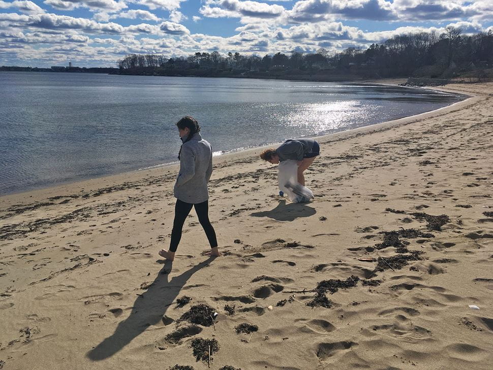 Students conducting beach cleanup